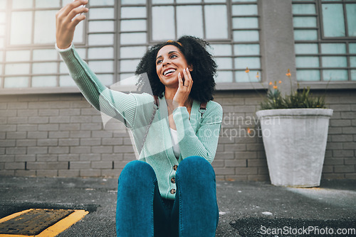 Image of Selfie, black woman and smartphone in city, happy and smile in the outdoor, streaming live and on sidewalk. Young girl, female and phone being cheerful, trendy and edgy on pavement for happiness.