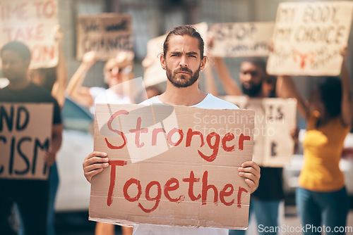 Image of Portrait, protest in street and group stand in solidarity, climate change and march together. Man, people and crowd support human rights, equality activism and blm movement for lgbtq, racism or earth