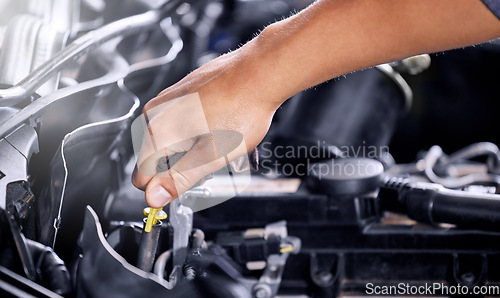 Image of Engineering, repair and mechanic working on a car, doing a service and check for problem with the engine at a workshop. Hands of a transportation technician doing maintenance on a van or vehicle