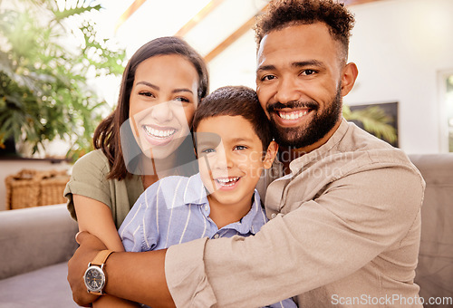 Image of Family, smile and love of child for his mom and dad while sitting together in the lounge at home sharing a special bond. Portrait of happy man, woman and boy kid smile and hug with parents in brazil