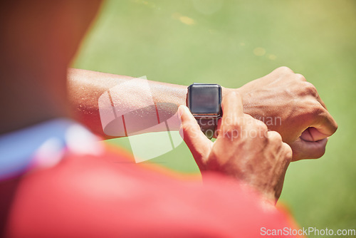 Image of Smartwatch, screen mock up and fitness hands man check time running results, sports or training workout progress on green pitch field. Athlete on smart watch for exercise goal tech with green mockup