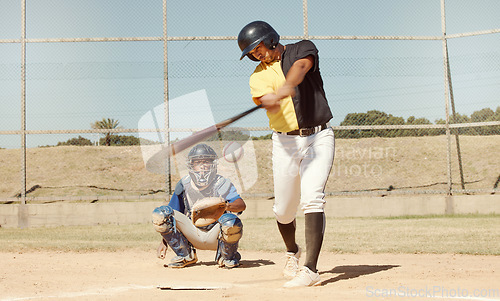 Image of Sports man, field and baseball player strike ball in game competition, practice or bat training workout. Softball pitch, health performance and athlete working on match fitness or power exercise