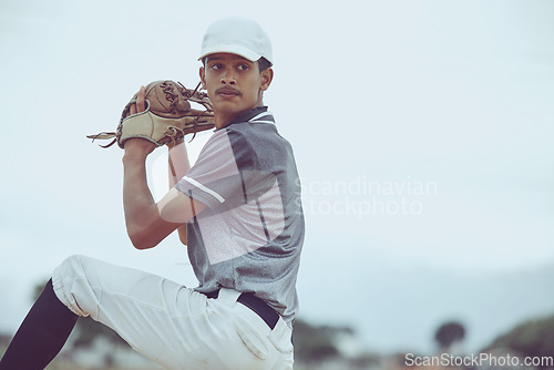 Image of Man, baseball and pitcher in sports throw or competitive match for point, score or win in the outdoors. Professional baseball player athlete in sport ready to pitch the ball on the field outside