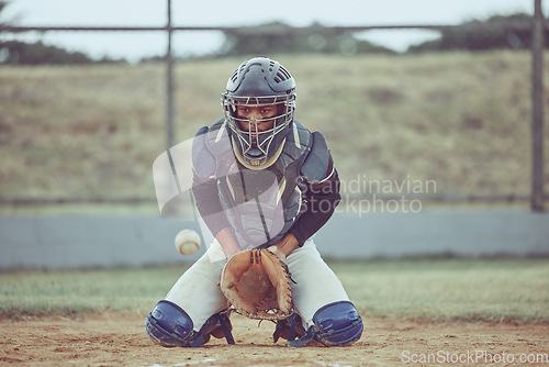 Image of Baseball, sports and catch a ball with a man athlete or catcher on a field during a game or match. Fitness, exercise and training with a male baseball player playing a competitive sport on a pitch