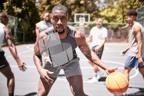 Image of Basketball player, team sports and motivation, focus and power for competition, game or training with community friends. Portrait of black man, group of people and neighborhood club basketball court