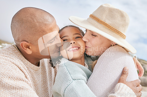 Image of Family beach, child travel and kiss with parents happy on holiday by the tropical weather on Island in Costa Rica during summer. Latino mother, father and girl with smile on vacation by the ocean