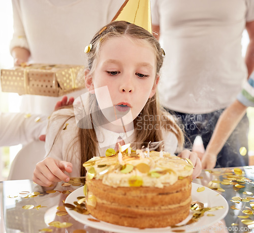 Image of Birthday, kid and cake candles celebration of a girl from Germany at a party in home. Celebrate, happy and candle blowing of child with happiness, food and people or family at a kids event in a house