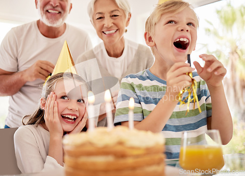 Image of Happy birthday, family and girl with a cake in a party celebration with grandparents and excited sibling or brother. Smile, happiness and young child celebrates, laughing and enjoying a special day