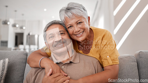 Image of Portrait of elderly love, grandparents smile on sofa and old couple relax at home in happy retirement. Senior man, grandmother on couch and smile in living room getting hug from retired wife on couch