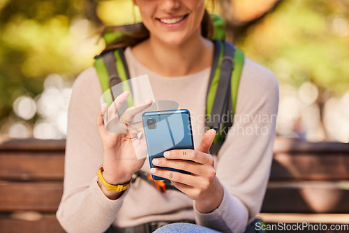 Image of Phone, hands and hiking woman relax outdoors check hike trail online using 5g tech internet device. Young girl smile, search travel direction or type social media smartphone communication in nature