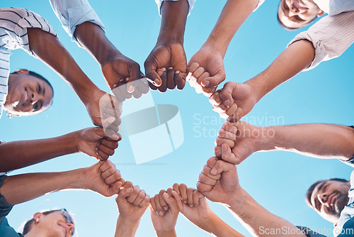 Image of Fist bump, teamwork and business people in a team building meeting for collaboration, motivation and support. Global, below view and workers hands in a huddle startup for goals, targets and mission