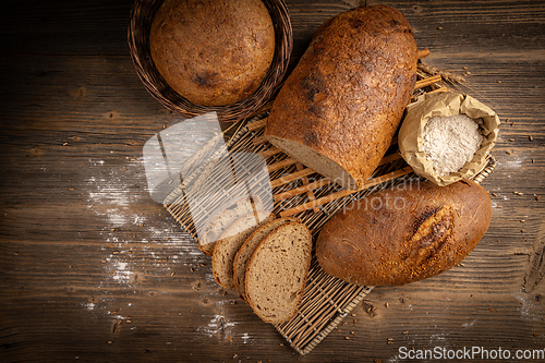 Image of Fresh bread on wooden background