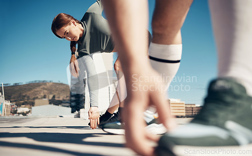 Image of Zoom of hands, woman stretching legs or runner shoes with friends for running exercise, fitness or marathon workout. Health, training or wellness athlete girl for sport, warm up or rooftop cardio.