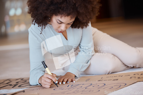 Image of Black woman, poster and being creative for protest, solidarity with Iran women or prepare for action. African American female, girl and create with cardboard box, draw and for climate change activist