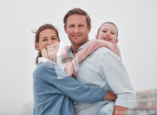 Image of Family, hug and outdoor, love and smile, together in nature and bonding in travel portrait. Parents, child and happy, hugging and piggy back, father with mother and girl, spending quality time.