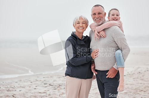 Image of Family, beach and children with grandmother, grandfather and boy on the sand by the sea during summer vacation. Travel, kids and retirement with a male child, man and woman enjoying an ocean holiday