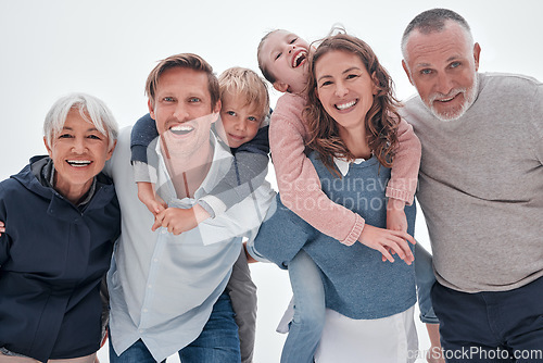 Image of Family, happy and kids hug with funny quality time with a smile and elderly people. Portrait of senior grandparents, parents and children laughing with happiness, love and care together smiling