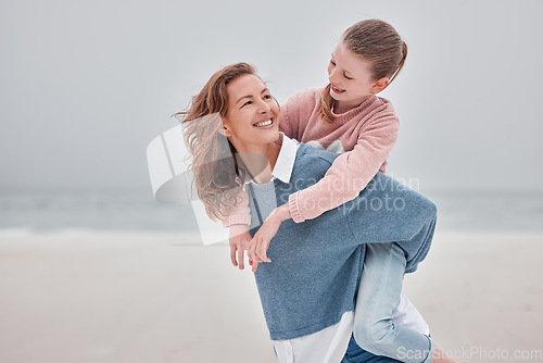 Image of Mother, child and piggyback for love on beach with smile for quality bonding time together in nature. Mama and kid smiling in joyful happiness for back ride embracing relationship on sandy ocean walk