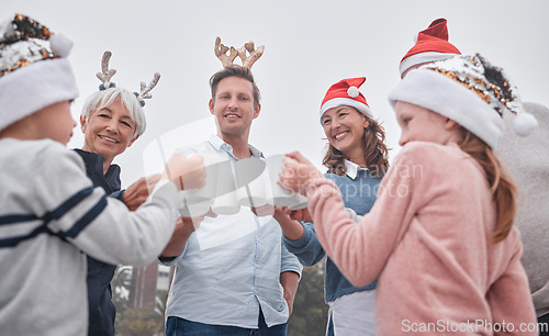 Image of Christmas, celebrate and happy family on holiday travel vacation bonding together with drinks. Grandparents, parents and kid celebrating, quality time December festive drinking hot chocolate outdoors