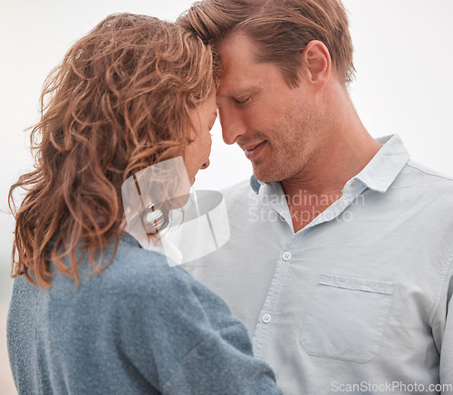 Image of Happy couple, love and commitment while outdoor in nature sharing a romantic moment and smile. Safe, secure and happy man and woman showing appreciation, bond and connection in romance relationship