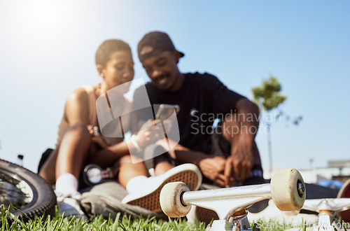 Image of Couple, phone or bonding in skateboard park, nature garden or grass field on internet search, trick tutorial or stunt learning. Smile, happy or skateboarder man and black woman with mobile technology