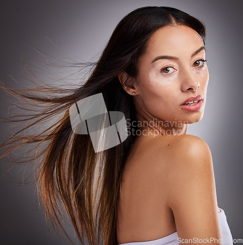 Image of Beauty, skincare and portrait of woman with vitiligo standing in studio with health facial routine. Cosmetic, natural and face of girl model from Mexico with piebald skin isolated by gray background.