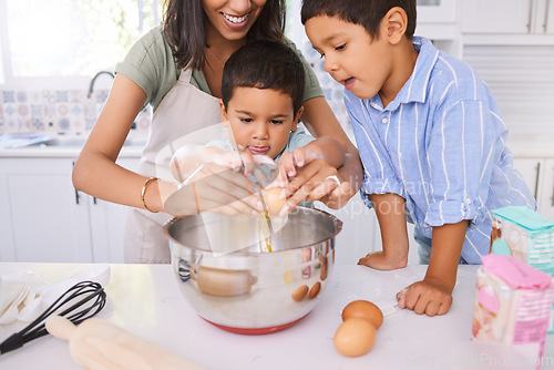 Image of Baking, mother and children learning about cooking, food and lunch in the kitchen together. Happy, young and mom teaching, helping and making a cake, cookies or dinner with kids in their house