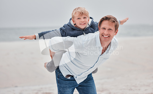Image of Family, portrait and airplane game by father and child at a beach, playing and having fun on a sea vacation. Happy family, children and fly with parent and son bonding, relax and enjoying ocean trip