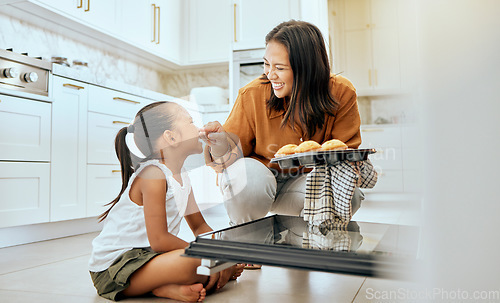 Image of Cooking, cupcake and happy family of mother and child baking dessert food in oven and enjoy fun quality time together. Love, happiness and youth girl or kid bonding with mom, mama or woman in kitchen