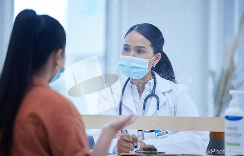 Image of Consulting doctor, woman and covid face mask in hospital, medical healthcare and Brazilian wellness clinic with patient. Medicine worker, employee or covid 19 insurance help people talking in checkup