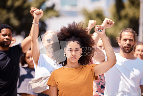 Image of People protest for freedom, support fist for climate change or black power empowerment in Los Angeles. Young woman, community rally together to fight for future human rights or global revolution