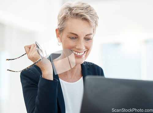 Image of Senior, executive and woman on laptop video call with client for friendly legal advice and talk. Mature lawyer lady with joyful smile online for professional communication holding glasses.