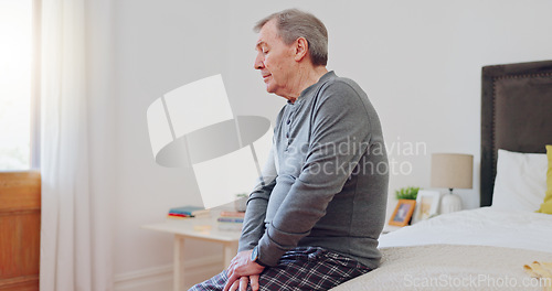 Image of Senior man, thinking and lonely in bedroom with depression, anxiety or mental health in retirement. Tired, elderly person and remember grief or loss in morning, home or sad in the house with a memory