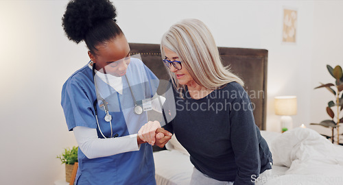 Image of Walking, support and doctor with senior woman in homecare facility for medical home consultation. Balance, recovery and elderly female with a nurse in bedroom for therapy, help or healthcare advice