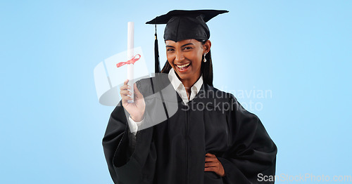 Image of Graduate woman, certificate and portrait in studio with pride, success and achievement by blue background. Graduation, girl and diploma with award, celebration or paperwork for future from university