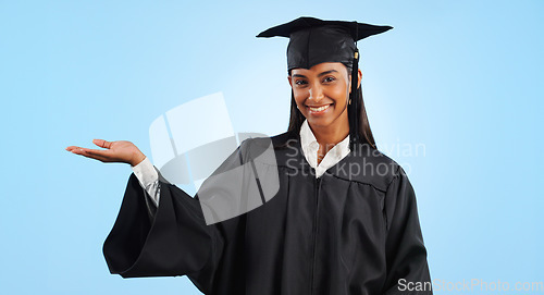 Image of Graduation student, portrait and happy woman palm gesture for learning news, university info or college study. Studio mockup space, presentation or graduate scholarship opportunity on blue background