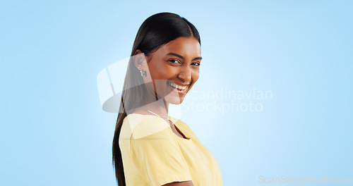 Image of Portrait, smile and Indian woman with joy, fashion and happiness on a blue background. Profile, face and person with casual outfit, excited and model with mockup space, student and happy with joy