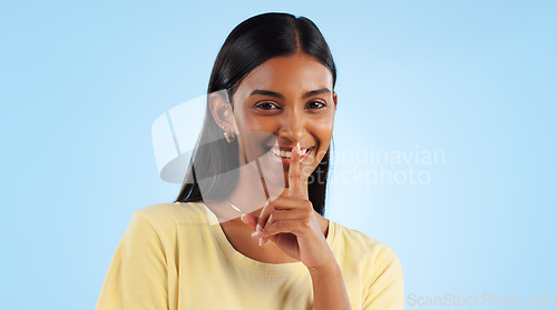 Image of Secret, portrait and woman with finger on lips, gossip and announcement with emoji on a blue background. Person, face or model with privacy, mockup space or drama news with surprise, whisper or shush