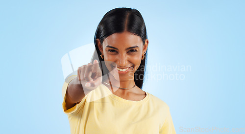 Image of Portrait, pointing to you and woman with motivation, emoji and reaction with happiness on a blue background. Face, happy person and model with hand gesture, mockup space and winning with support