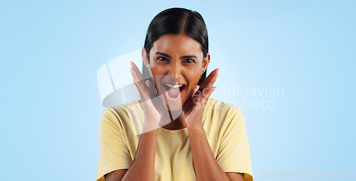 Image of Wow, portrait and woman or excited for surprise, winner or announcement in studio with mock up space. Indian, face or person with surprised expression for discount, sale or success on blue background