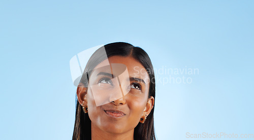 Image of Woman, thinking in studio and ideas for inspiration and dream, future with mockup space on blue background. Question, decision and problem solving, solution with brainstorming and mindfulness