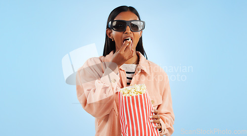 Image of Woman, cinema and 3D glasses with popcorn, streaming and entertainment with vision on blue background. Theater corn snack, film or movie with user experience, television and holographic in studio