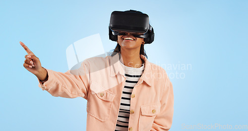 Image of Virtual reality, press on screen and woman with future technology and smile in studio on blue background. Hologram, 3D and metaverse, digital world and high tech with user experience and VR software