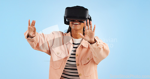 Image of Virtual reality, hands on screen and woman with future technology and smile in studio on blue background. Hologram, 3D and metaverse, digital world and high tech with user experience and VR software