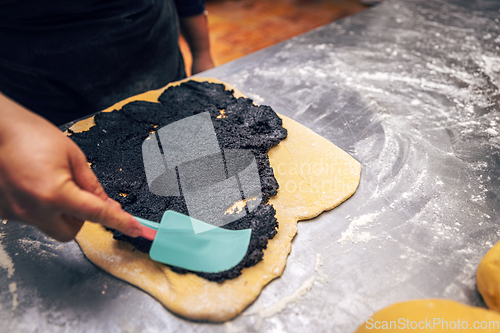 Image of Sweet dough covered with poppy seeds.