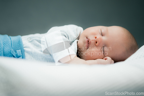 Image of Close-up portrait of adorable baby boy sleeping in bed, 1 year old baby concept