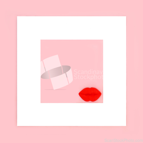 Image of Luscious Red Lips with White Frame on Pink Background 