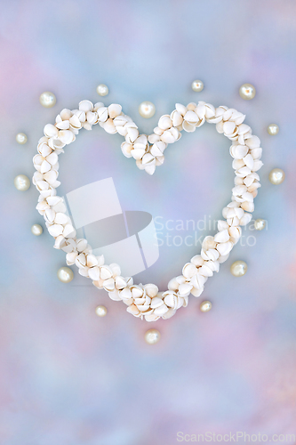 Image of Heart Shaped Cockleshell and Pearl Wreath on Rainbow Sky