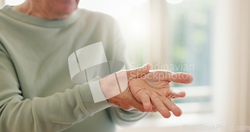 Image of Senior person, hands and wrist with pain, injury and orthopedic wound at home. Closeup, elderly and ache for arthritis, fibromyalgia and osteoporosis of muscle joint, carpal tunnel and health risk