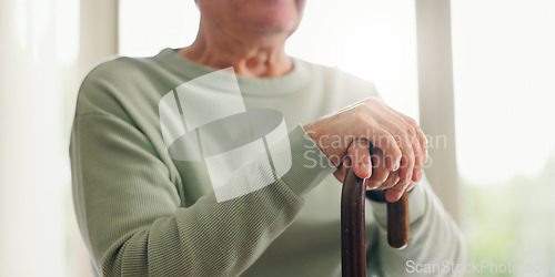 Image of Hands, senior and walking stick, person with a disability and closeup with wellness. Elderly care, cane to help with balance and support with Parkinson disease or arthritis, sick and health issue